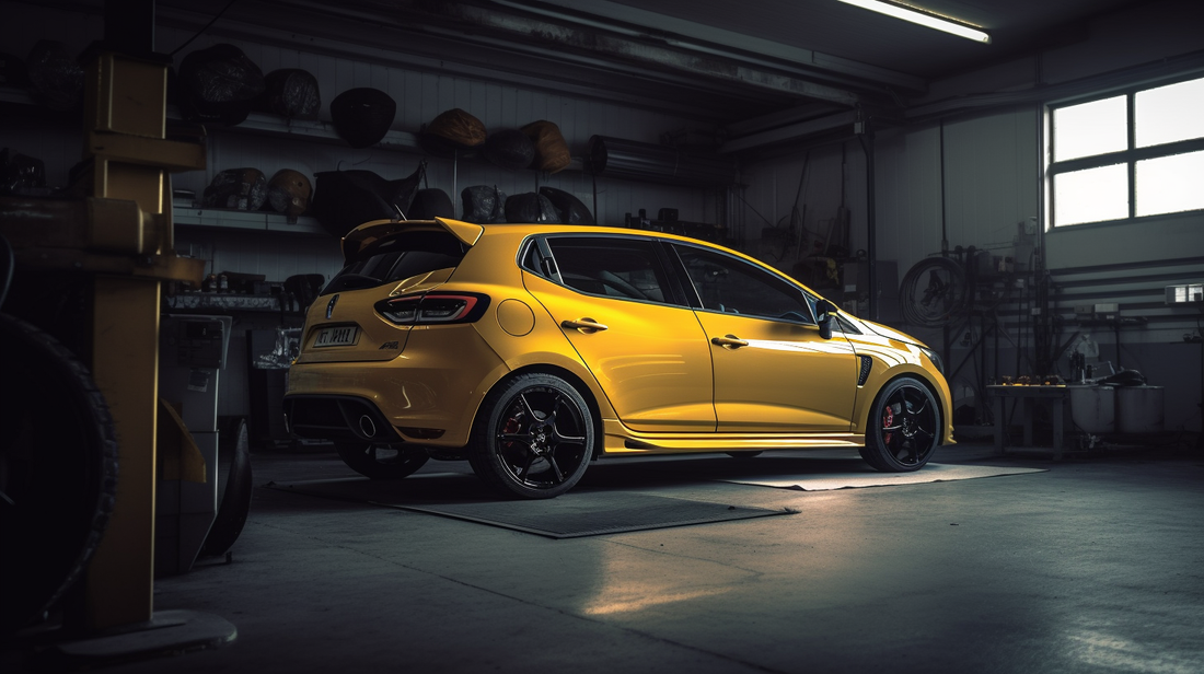 A yellow Renault Clio RS receiving a service