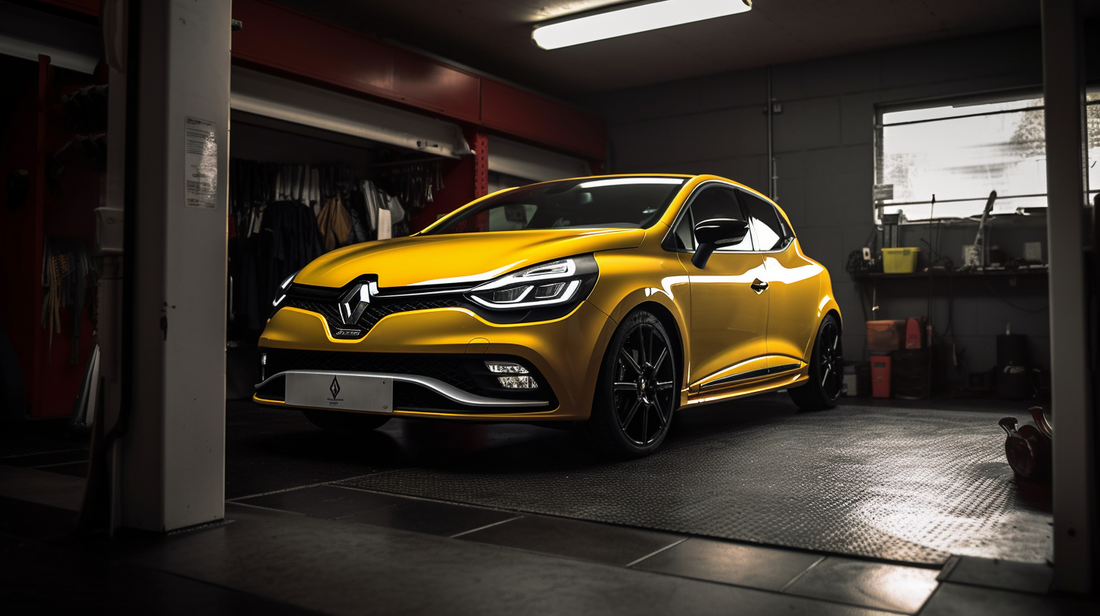 a yellow Renault Clio RS getting a service
